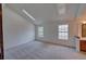Spacious bedroom with carpet, natural light from two windows, and an ensuite bath at 2713 W Long Dr # C, Littleton, CO 80120