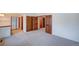 Bedroom featuring carpet, ample closet space, and doors to other rooms at 2713 W Long Dr # C, Littleton, CO 80120