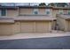Exterior shot of townhouse with attached garages and ample parking at 2713 W Long Dr # C, Littleton, CO 80120