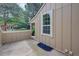 Enclosed back patio area with wood siding and a small garden, offering privacy and outdoor space at 2713 W Long Dr # C, Littleton, CO 80120