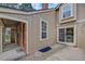 Private patio area with exterior door to kitchen at 2713 W Long Dr # C, Littleton, CO 80120