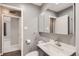 Bathroom with vanity and tiled walls at 3016 S Grape Way, Denver, CO 80222