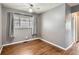 Cozy bedroom featuring hardwood floors and neutral paint, offering a tranquil space for rest and relaxation at 3016 S Grape Way, Denver, CO 80222