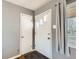 Bright entryway features neutral wall paint, tiled floor, and natural light, providing a clean and inviting first impression at 3016 S Grape Way, Denver, CO 80222