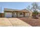 Charming single-story home with attached garage and inviting front porch at 3016 S Grape Way, Denver, CO 80222