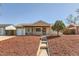 Charming single-story home featuring a well-manicured lawn and inviting entrance, creating a welcoming curb appeal at 3016 S Grape Way, Denver, CO 80222