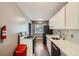 Modern kitchen with new appliances and ample counter space, ideal for culinary enthusiasts and everyday meal preparation at 3016 S Grape Way, Denver, CO 80222