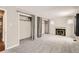 Open living space with fireplace and open closets at 3016 S Grape Way, Denver, CO 80222