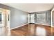 Hardwood floors and a bright window, creating a warm and welcoming atmosphere for Gathering and guests at 3016 S Grape Way, Denver, CO 80222