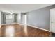 Spacious living room with hardwood floors, offering a cozy and versatile area for relaxation and entertainment at 3016 S Grape Way, Denver, CO 80222