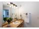Light and airy bathroom with a large mirror, vanity, and modern light fixtures at 3260 E 103Rd Pl # 912, Thornton, CO 80229