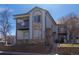 Apartment building featuring stone accents, balconies, and 'For Sale' signs at 3260 E 103Rd Pl # 912, Thornton, CO 80229