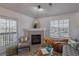 Living room features a fireplace, and a sliding glass door to balcony with views of the neighborhood at 3260 E 103Rd Pl # 912, Thornton, CO 80229