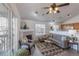 Living room features a fireplace, and a sliding glass door to balcony with views of the neighborhood at 3260 E 103Rd Pl # 912, Thornton, CO 80229