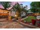 Picturesque backyard with a dining area, manicured lawn, and garden at 848 S Emerson St, Denver, CO 80209