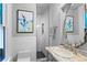 Stylish bathroom featuring patterned tile floor, shower and sink with ornate mirror at 848 S Emerson St, Denver, CO 80209