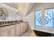 Elegant bathroom featuring a double vanity, clawfoot tub, and decorative windows at 848 S Emerson St, Denver, CO 80209