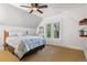 Cozy bedroom with a vaulted ceiling, double windows and a comfortable bed at 848 S Emerson St, Denver, CO 80209