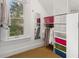 Walk-in closet with built-in shelving and colorful storage containers at 848 S Emerson St, Denver, CO 80209