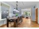 Bright dining room with a large window, a wooden table, and hardwood floors at 848 S Emerson St, Denver, CO 80209