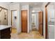 Hallway with wood cabinet, tiled floor, and washer/dryer hookups at 848 S Emerson St, Denver, CO 80209