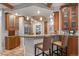 Open kitchen design with granite countertops, wooden cabinetry and stainless appliances at 848 S Emerson St, Denver, CO 80209