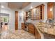 Bright kitchen features granite counters, wood cabinetry and stainless steel appliances at 848 S Emerson St, Denver, CO 80209