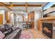 Open-concept living area with a fireplace and seamless access to a modern kitchen at 848 S Emerson St, Denver, CO 80209