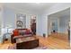 Stylish living room with hardwood floors, a comfortable leather couch, and natural light at 848 S Emerson St, Denver, CO 80209