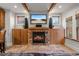 Cozy living room with stone fireplace, wood beam ceiling and built-in cabinets at 848 S Emerson St, Denver, CO 80209