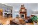 Comfortable living room featuring a decorative fireplace, hardwood floors, and ample seating at 848 S Emerson St, Denver, CO 80209