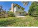 View of the home and the backyard, featuring a patio and grassy lawn at 16623 E Asbury Pl, Aurora, CO 80013
