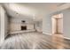 Spacious basement with modern flooring, brick fireplace, neutral paint, and good lighting at 16623 E Asbury Pl, Aurora, CO 80013