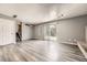 Large finished basement offering new flooring, ample natural light, a walkout, and a fireplace at 16623 E Asbury Pl, Aurora, CO 80013