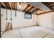 Unfinished basement with exposed ceiling and mechanicals provides ample storage at 16623 E Asbury Pl, Aurora, CO 80013