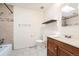 This bathroom features a vanity, toilet, shower over tub, and decorative tiles at 16623 E Asbury Pl, Aurora, CO 80013