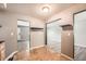 Cozy entryway featuring neutral paint, tile floors, and open access to multiple rooms with wood-style floors at 16623 E Asbury Pl, Aurora, CO 80013