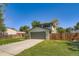 Two-story home featuring an attached two-car garage and a well-maintained front lawn at 16623 E Asbury Pl, Aurora, CO 80013
