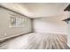 Bright living room with a large window, wood-look floors, and neutral paint at 16623 E Asbury Pl, Aurora, CO 80013