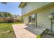 A concrete patio with sliding glass doors gives access to the backyard at 16623 E Asbury Pl, Aurora, CO 80013