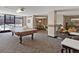 Spacious common area featuring a pool table, comfortable seating, and dining space at 1020 15Th St # 24H, Denver, CO 80202