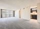 Spacious living room with a balcony and an adjacent kitchen area at 1020 15Th St # 24H, Denver, CO 80202