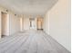 Spacious living room with neutral walls, plush carpet, and sliding mirror closet doors, great for entertaining at 1020 15Th St # 24H, Denver, CO 80202