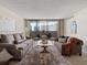 Bright living room featuring two sofas and a balcony overlooking the city at 1020 15Th St # 24H, Denver, CO 80202