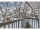 Balcony view featuring neighborhood landscape and bare trees under winter sky at 1760 S Ammons St # D, Lakewood, CO 80232