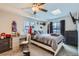 Cozy bedroom with natural light, neutral carpet, closet and modern decor at 1760 S Ammons St # D, Lakewood, CO 80232