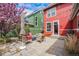 Charming backyard featuring stone pavers, comfortable seating, and decorative string lights, perfect for entertaining at 8460 E 54Th Dr, Denver, CO 80238