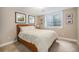 Tranquil bedroom featuring a comfortable bed, soft lighting, and a window for natural light, creating a relaxing space at 8460 E 54Th Dr, Denver, CO 80238