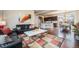 Open-concept living space with a modern kitchen, living room, and dining area at 8460 E 54Th Dr, Denver, CO 80238