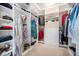 A well-organized walk-in closet features custom shelving, ample hanging space, and built-in drawers for storage at 8460 E 54Th Dr, Denver, CO 80238